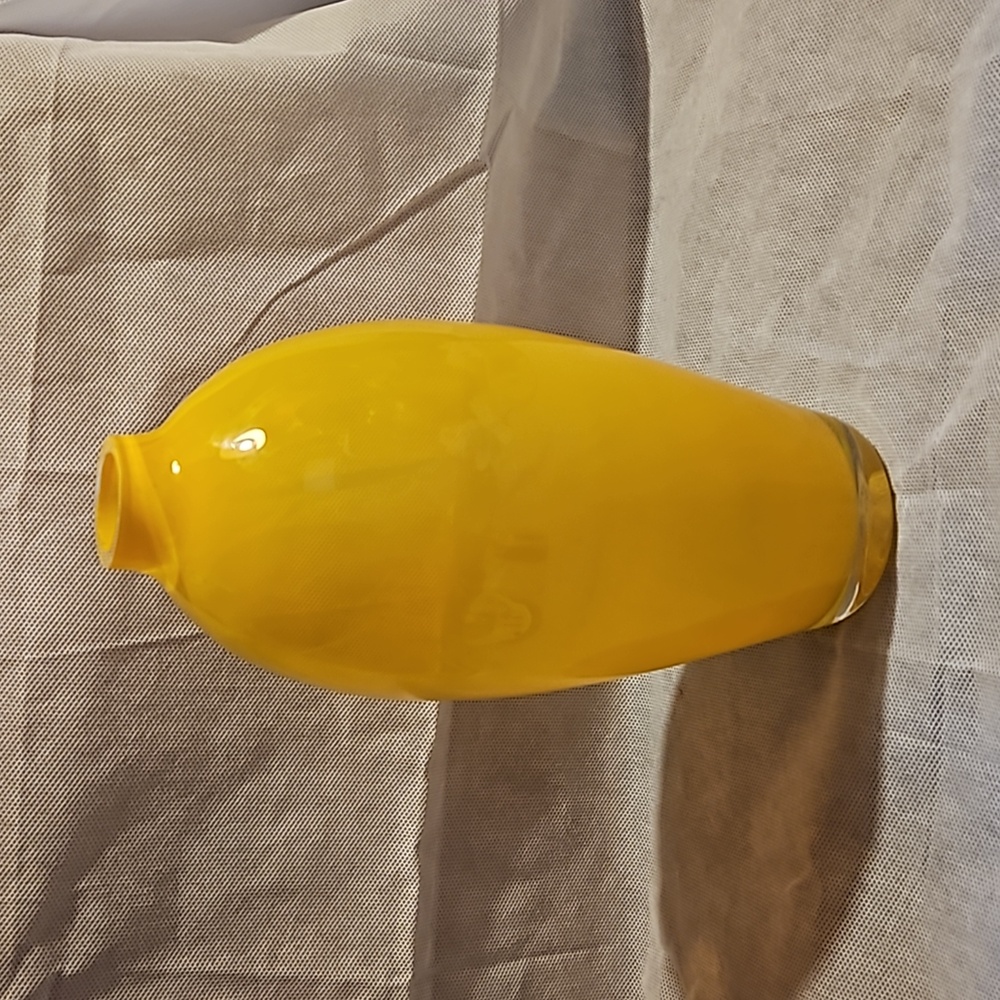 Decorative vase / bottle yellow with clear glass.